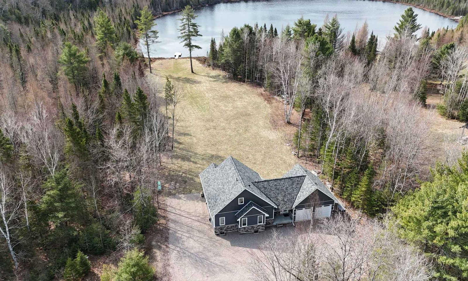Aerial view of completed lakefront custom home site in Bancroft, Ontario