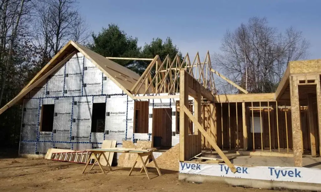 Exterior framing of lakefront custom home under construction in Bancroft, Ontario