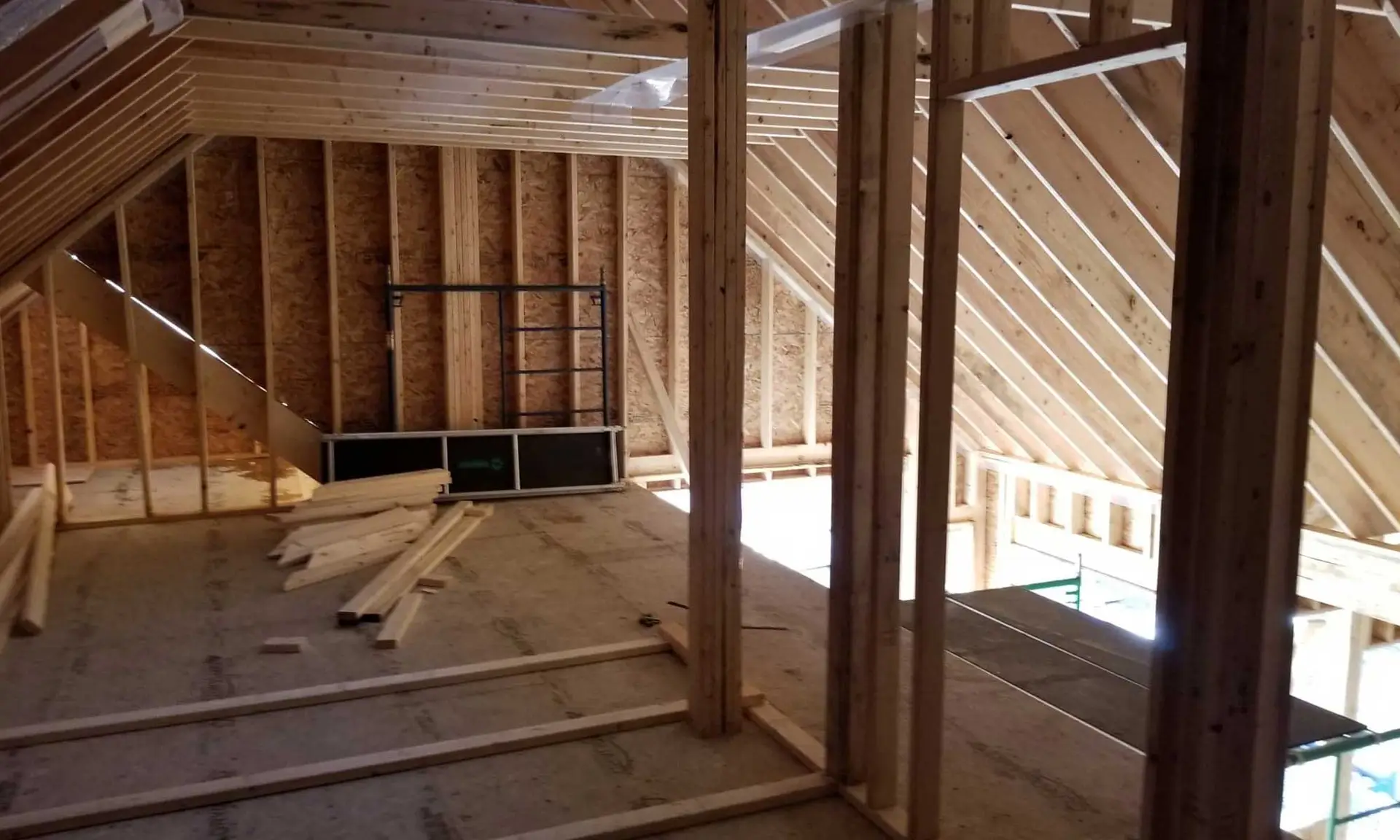 Interior framing of lakefront custom home under construction in Bancroft, Ontario