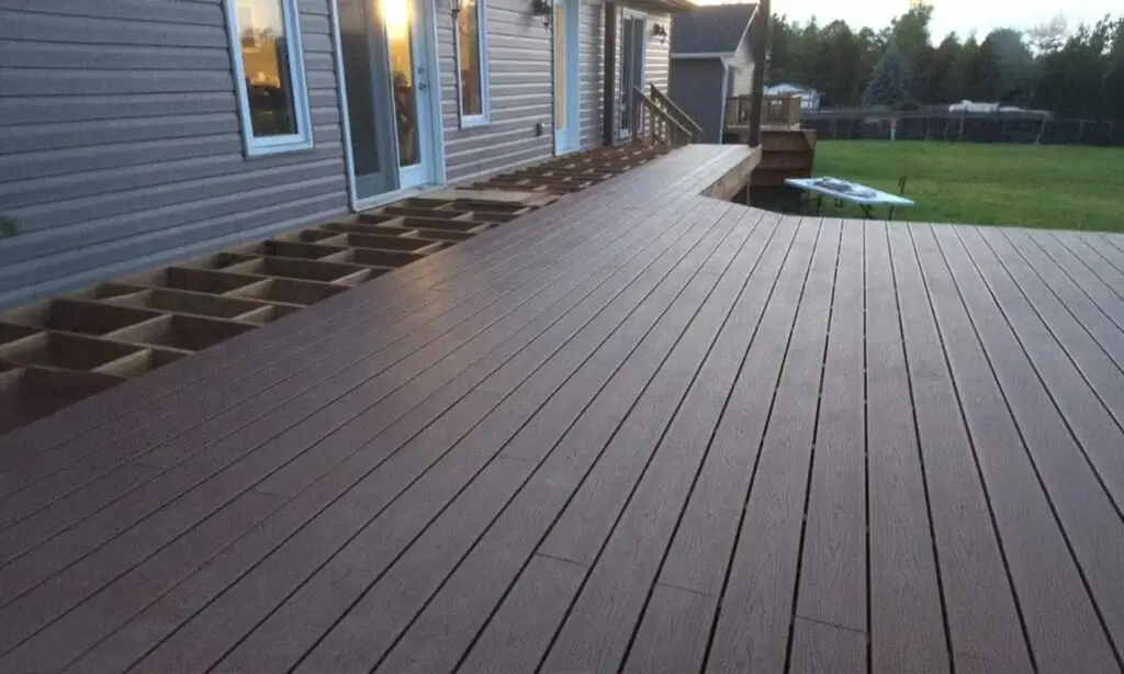 Residential exterior deck construction showing new decking installation