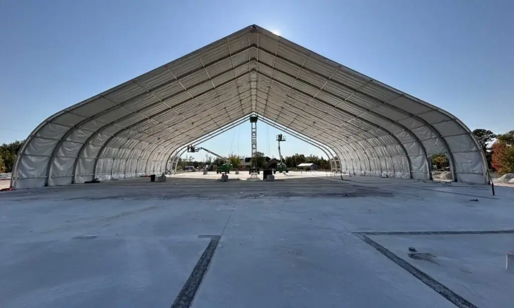 Municipal community arena construction with steel framing and slab work